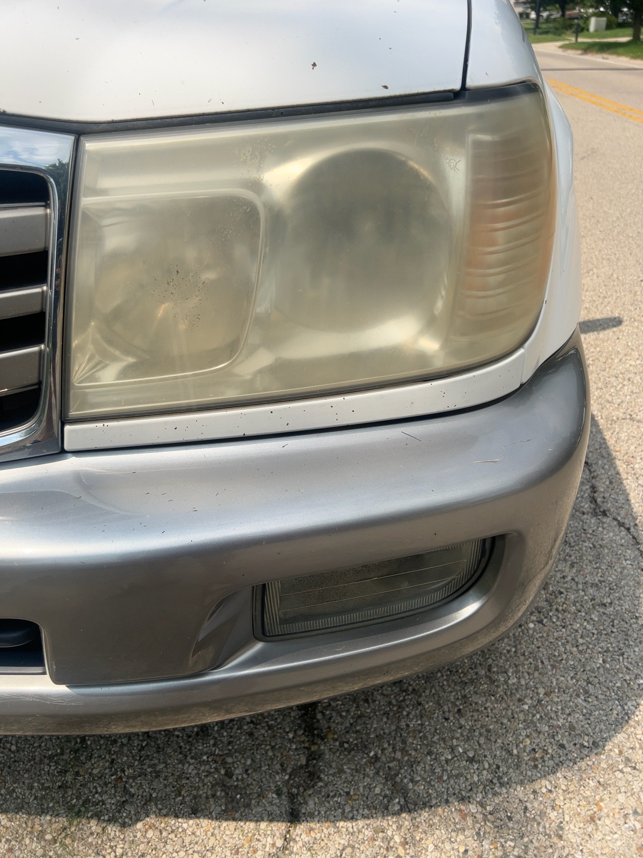 Before restoration - cloudy and oxidized 2005 Toyota Land Cruiser headlight